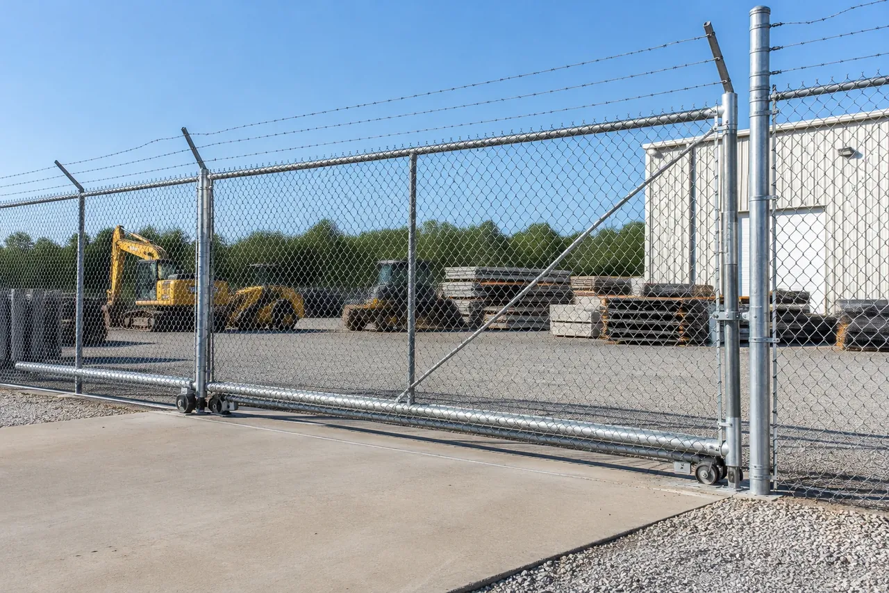 Commercial galvanized chain link fence with a rolling gate in Lubbock