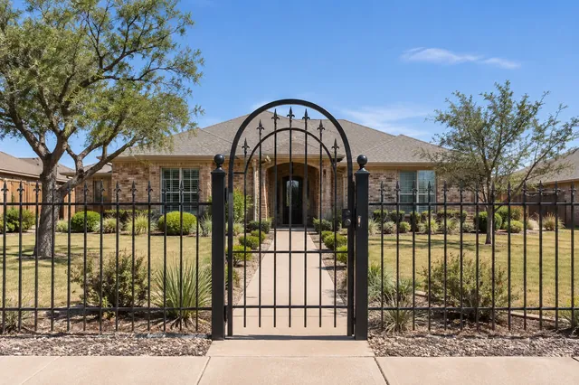 A matching entry gate for an ornamental front fence.